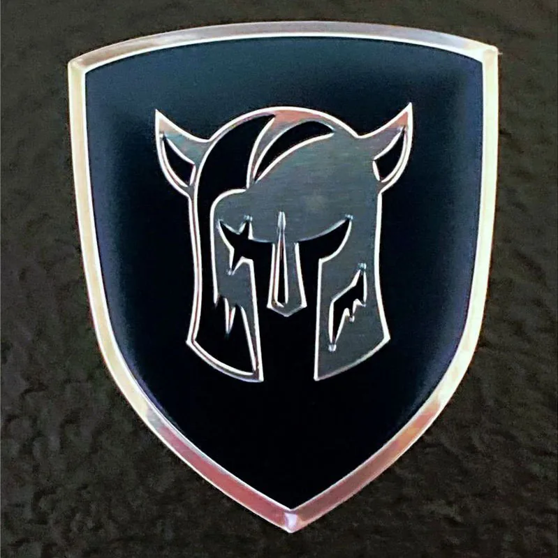 3D nameplate with a raised chrome helmet logo on a black shield