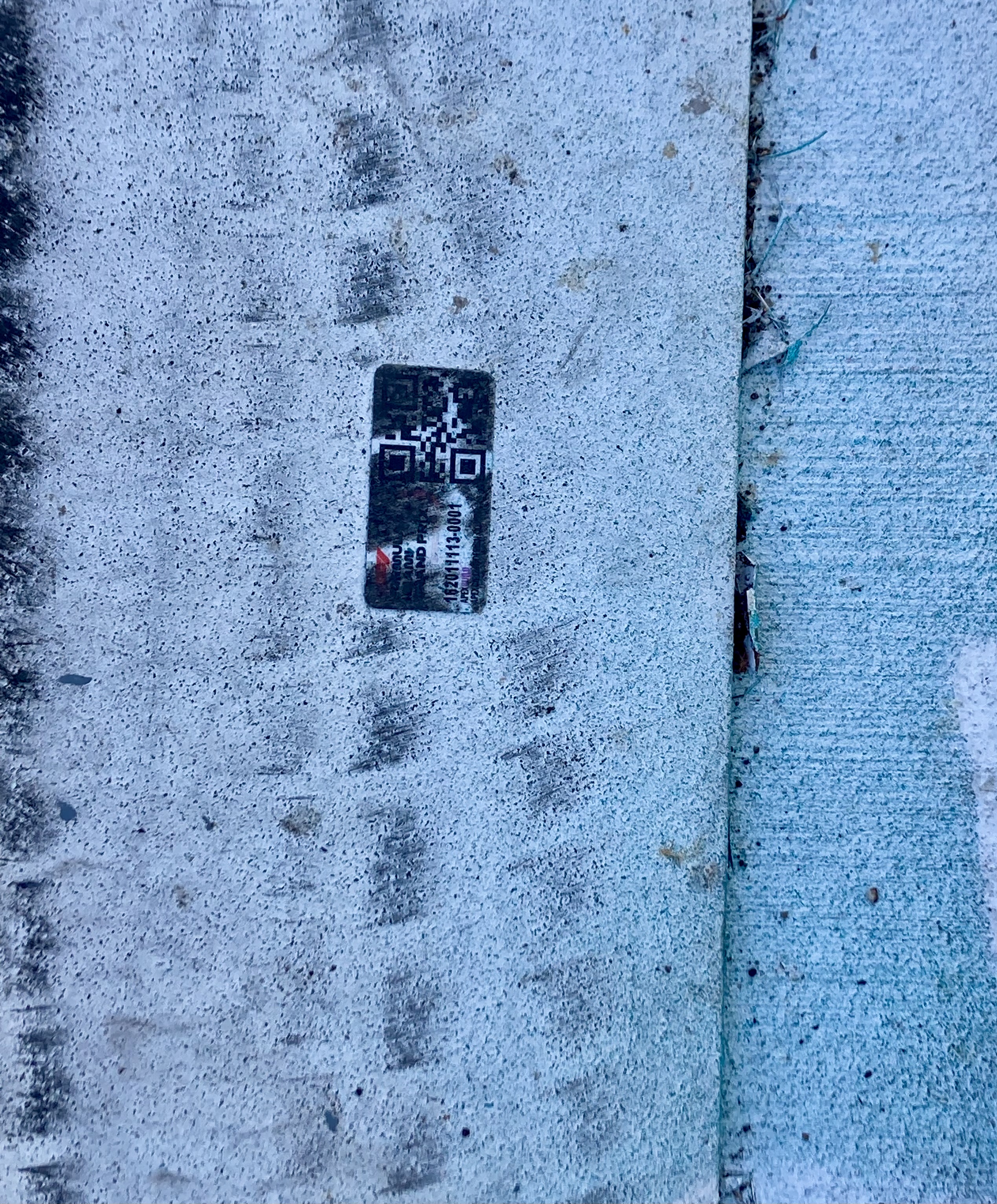 Same Strongest Level tag still readable on the F1 concrete barrier after the race